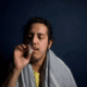 A gay person smoking weed.