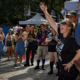 An image of LGBTQ individuals attending pride on the block.