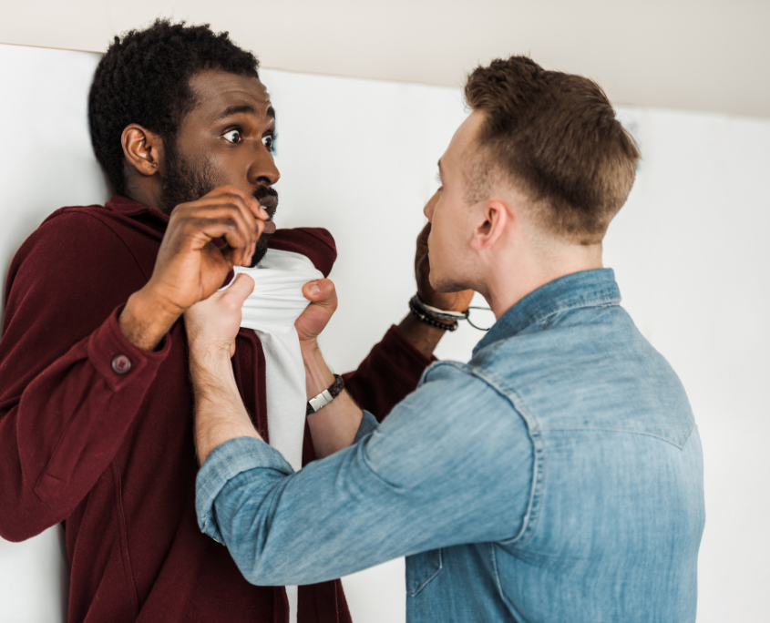 Two gay men arguing intensely, representing conflict in a trauma bonding relationship