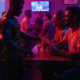 A group of LGBTQ individuals as they enjoy nightlife, highlighting the duality of gay nightlife and mental health and the crucial connection between them.