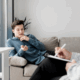 An image of a gay person and a therapist writing on a chart during therapy.
